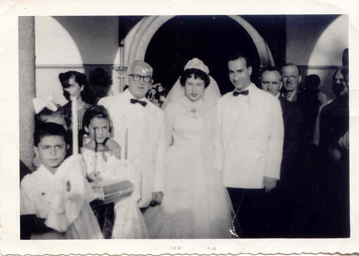 John G. Matthews & Eleni Ntakos Matthews in Lesvos-Eleni's Father Ignatios Ntakos standing Behind John..jpg